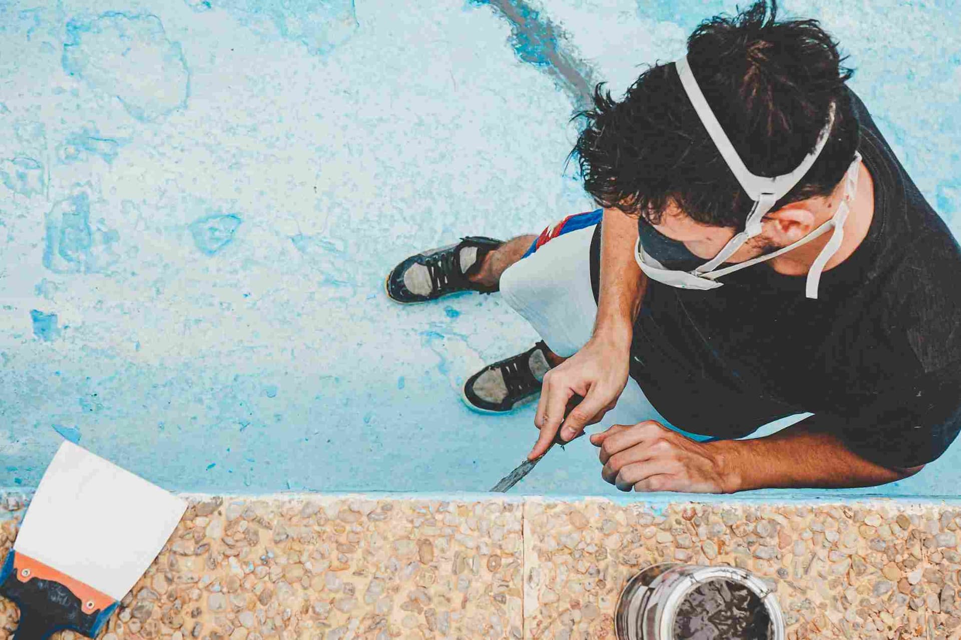 young-man-working-in-his-swimming-pool